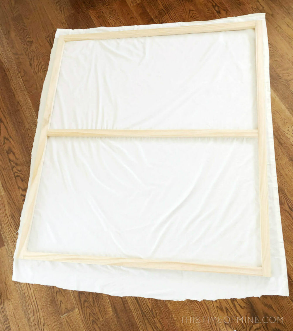 wood frame for large canvas art on top of white sheet