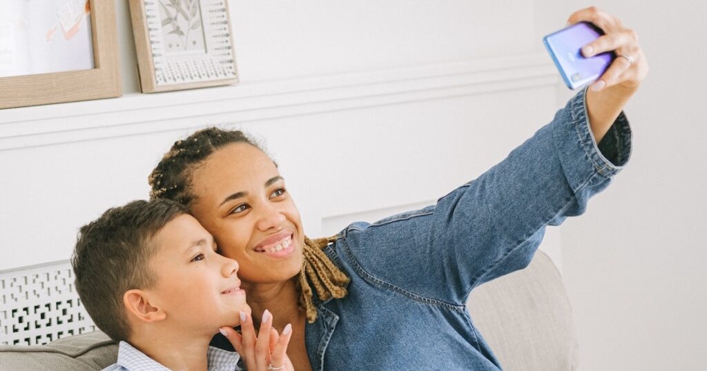 mom taking selfie with son | This Time Of Mine