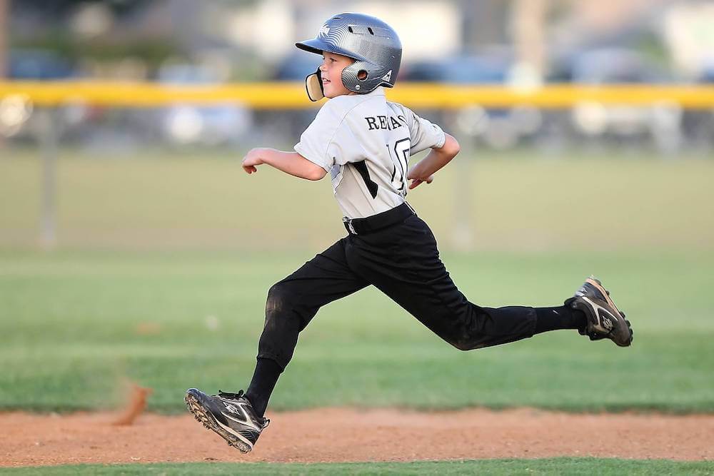 boy running in baseball | helping kids gain confidence | This Time Of Mine