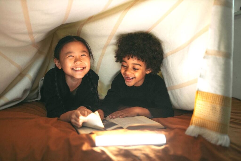 kids reading in a fort | This Time Of Mine